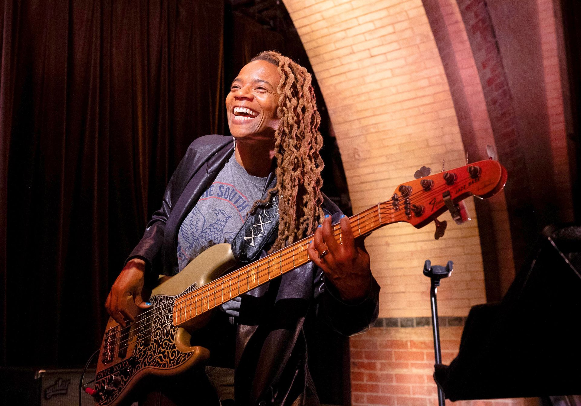 artist playing a guitar